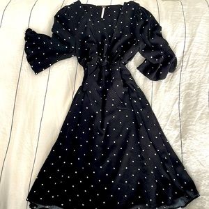 Perfectly tailored free people polka dot black dress.